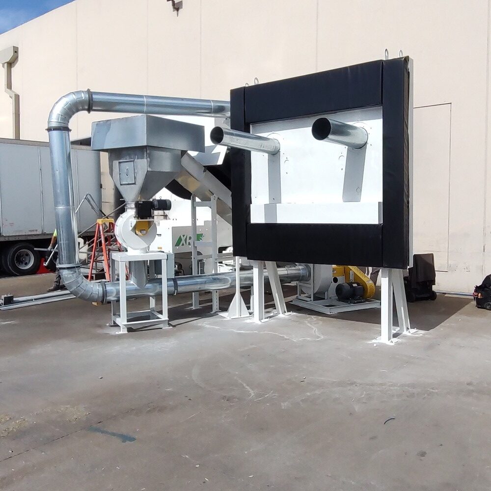 Cresswood industrial grinder reducing pallet wood trash into clean, recyclable material