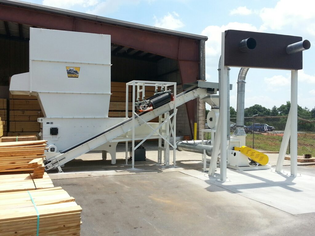 Boulware wood scrap grinding system processing pallet waste for recycling